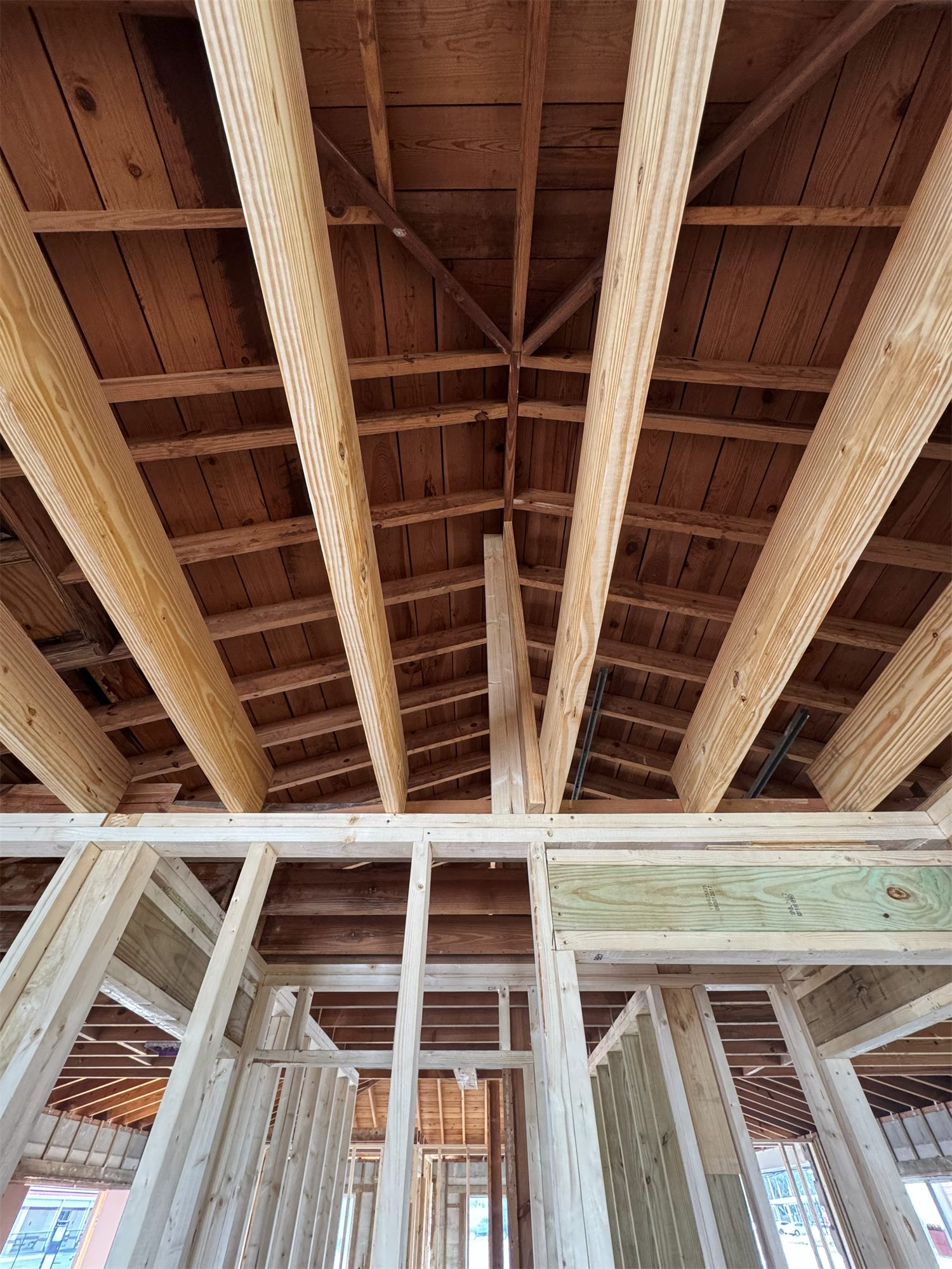 Roof and wall framing of a home under construction, seen from inside